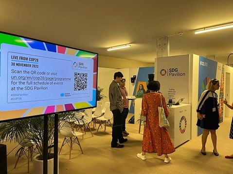 A group of people standing in a room